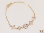 Gold plated chain bracelet with cz clovers and flowers