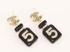 Double C gold danglers with 5 in CZ on black enamel