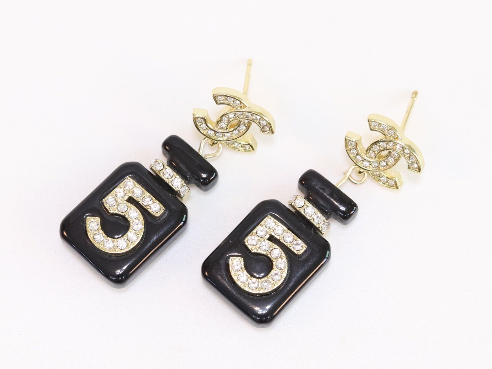 Double C gold danglers with 5 in CZ on black enamel