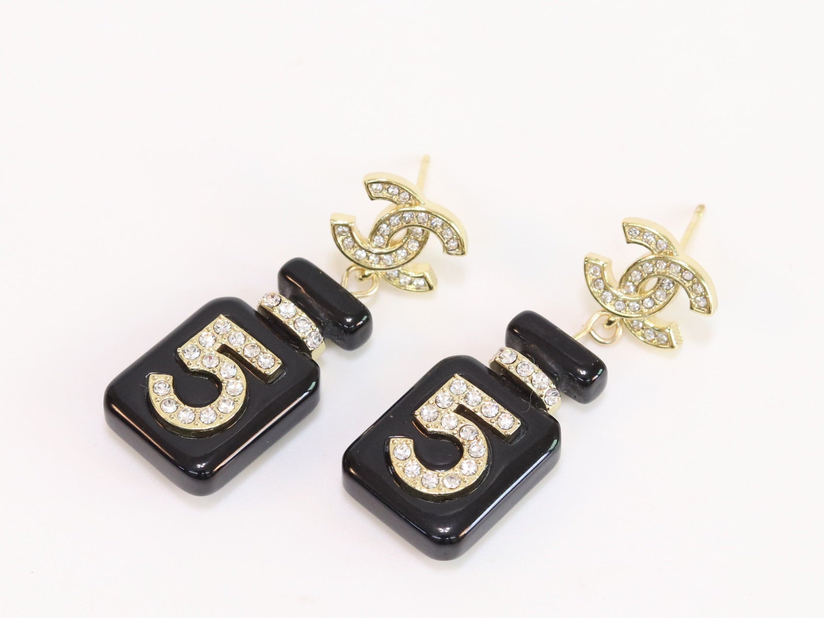 Double C gold danglers with 5 in CZ on black enamel