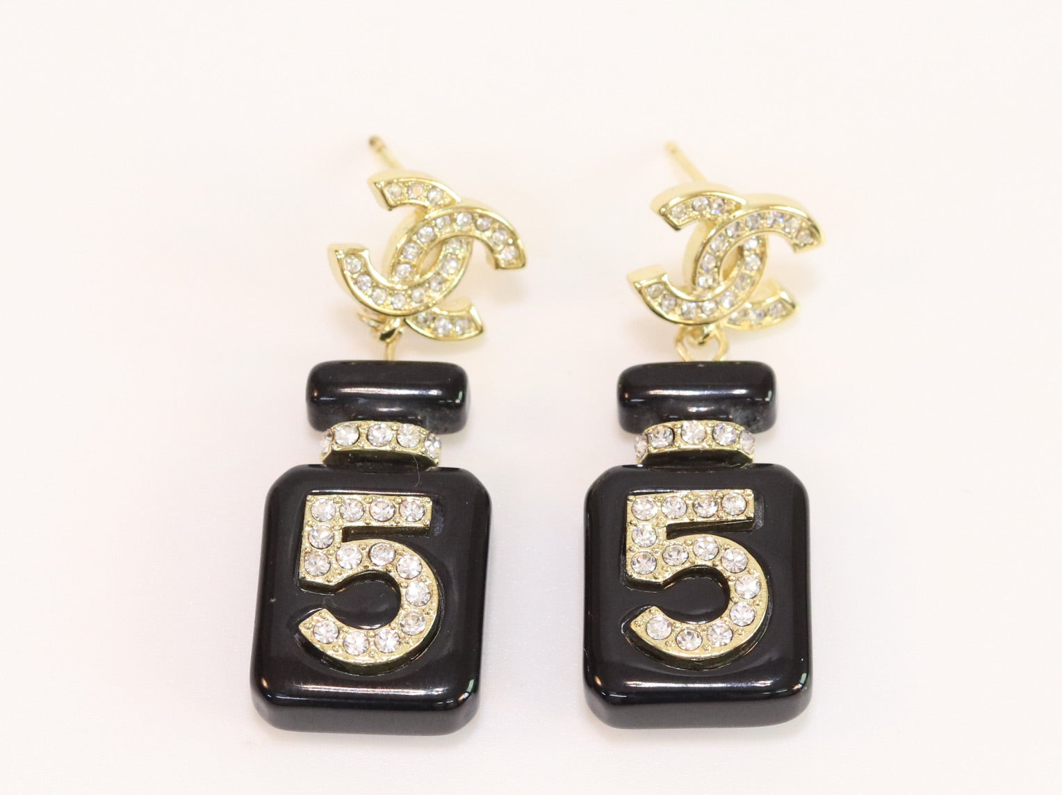 Double C gold danglers with 5 in CZ on black enamel