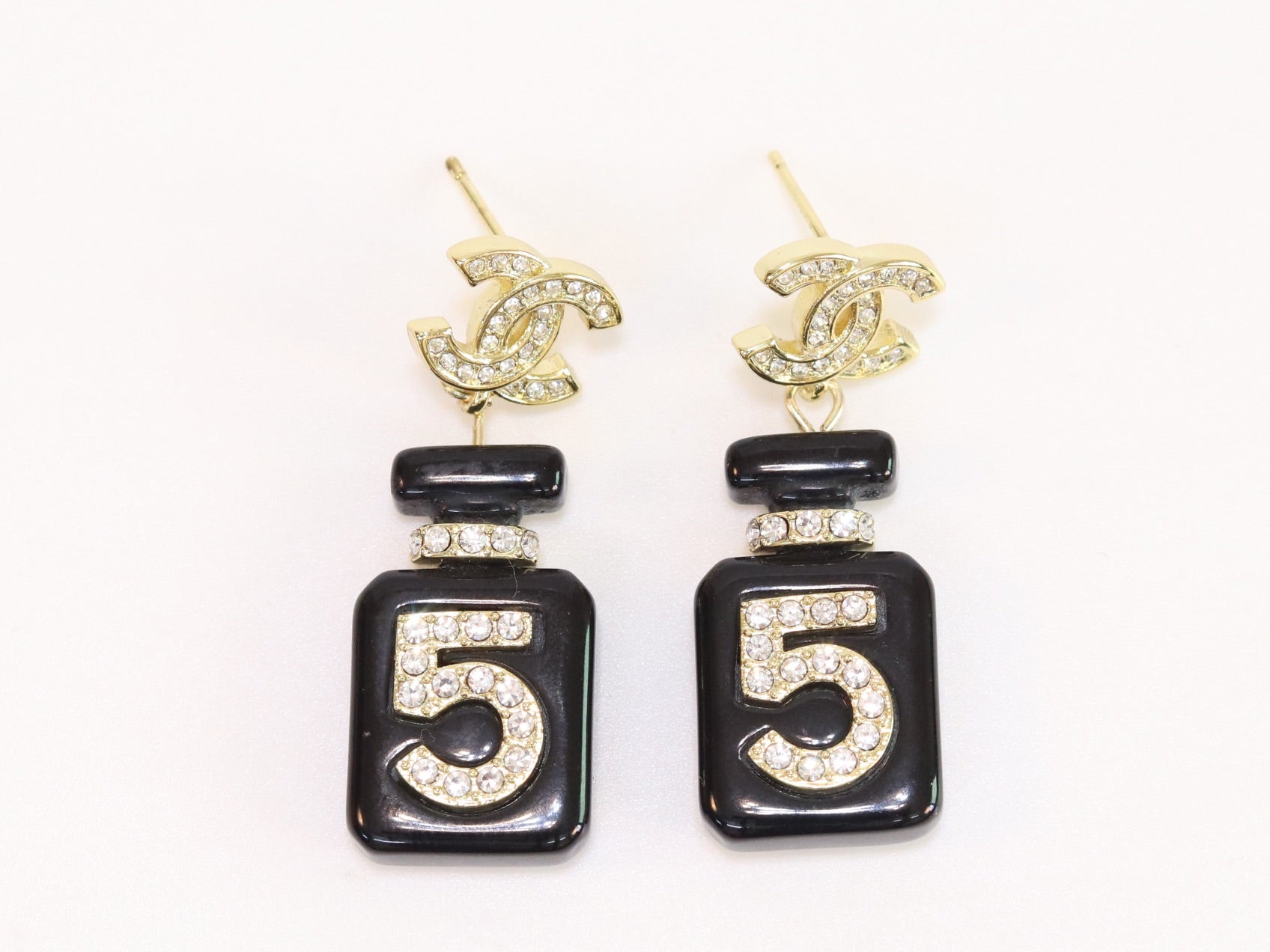 Double C gold danglers with 5 in CZ on black enamel