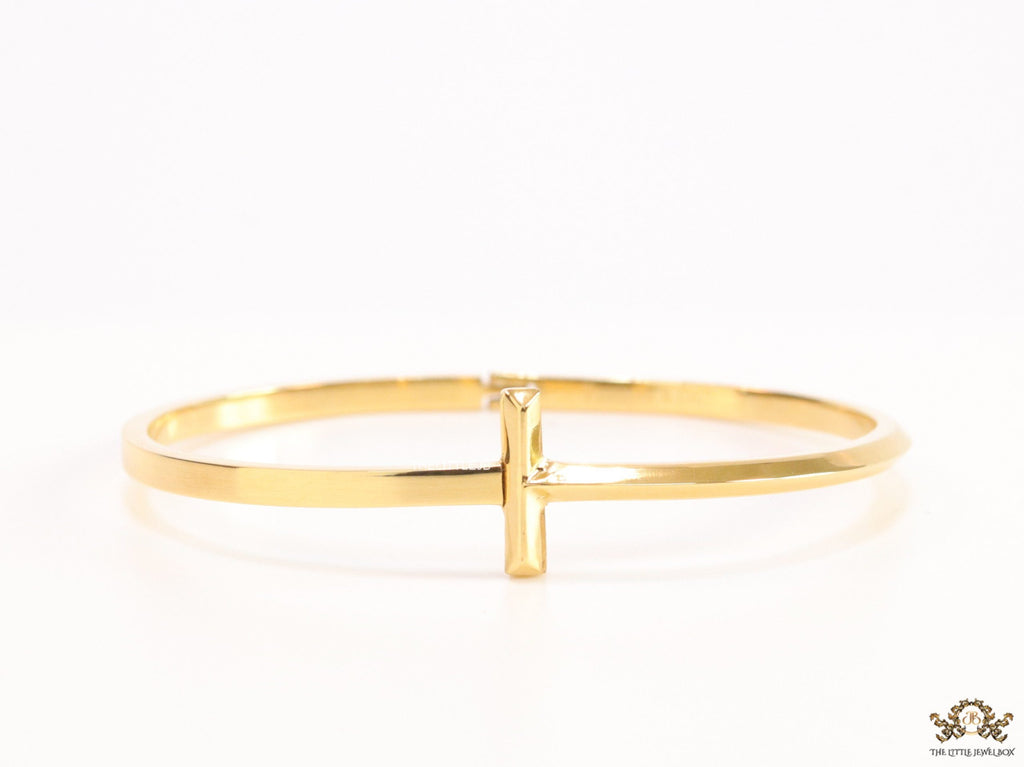 Gold plated bracelet with T motif centre