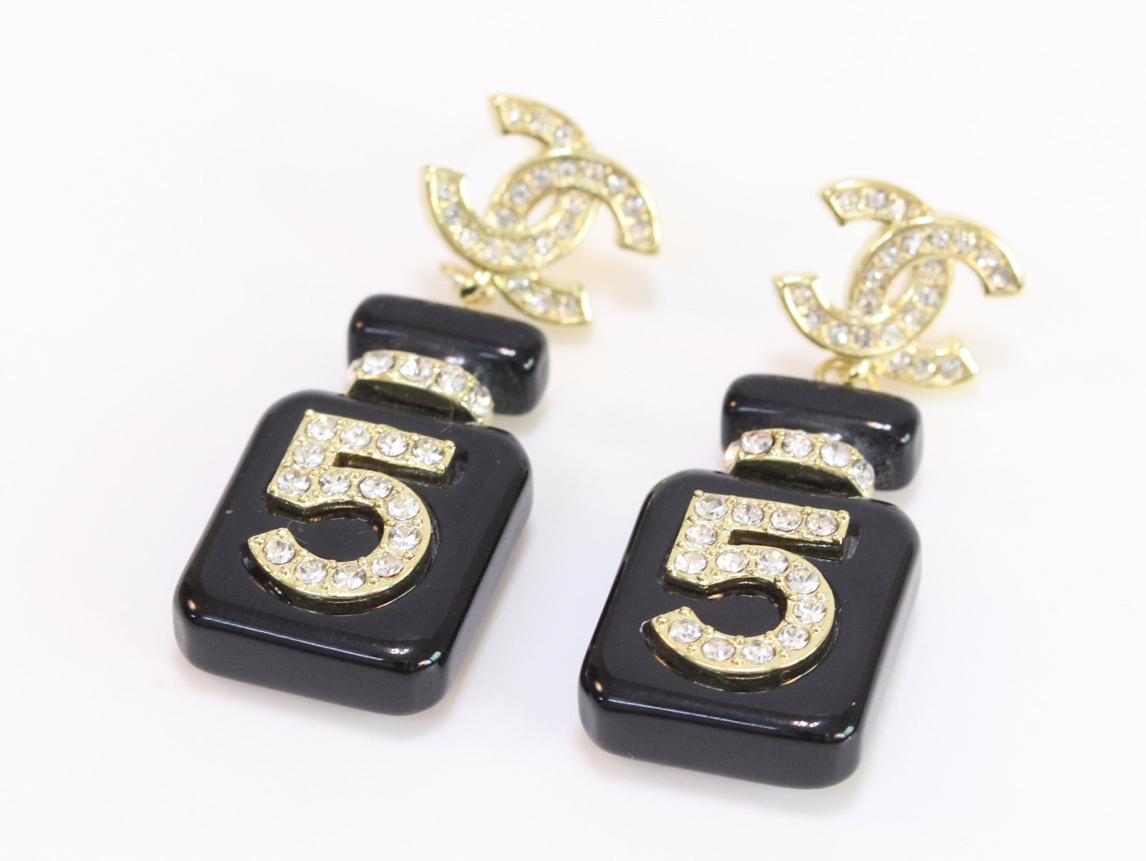 Double C gold danglers with 5 in CZ on black enamel