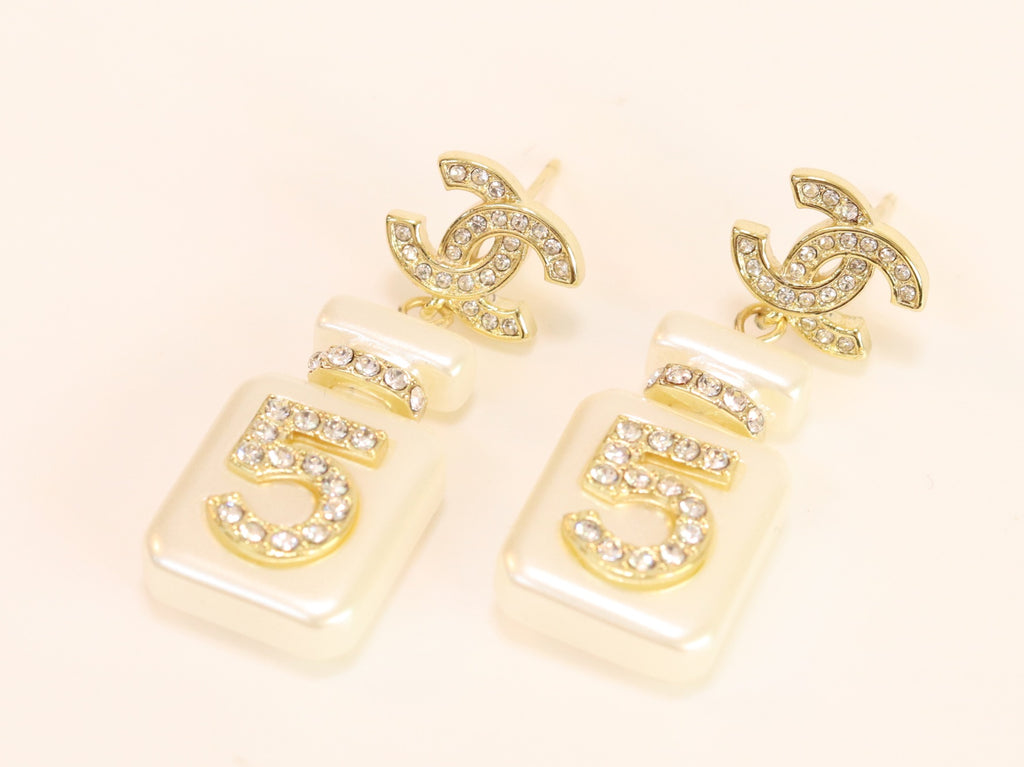 Double C gold danglers with 5 in CZ on white enamel