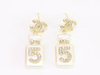 Double C gold danglers with 5 in CZ on white enamel