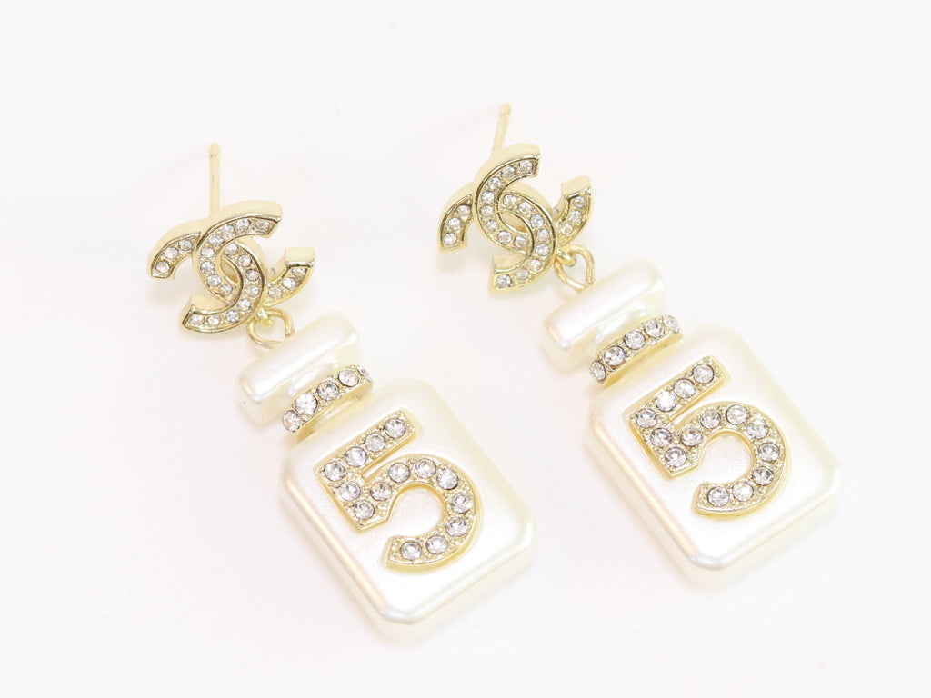 Double C gold danglers with 5 in CZ on white enamel