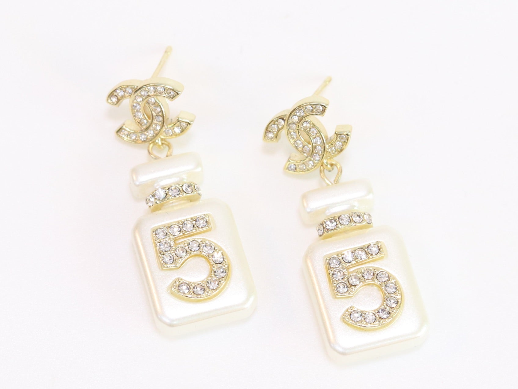 Double C gold danglers with 5 in CZ on white enamel