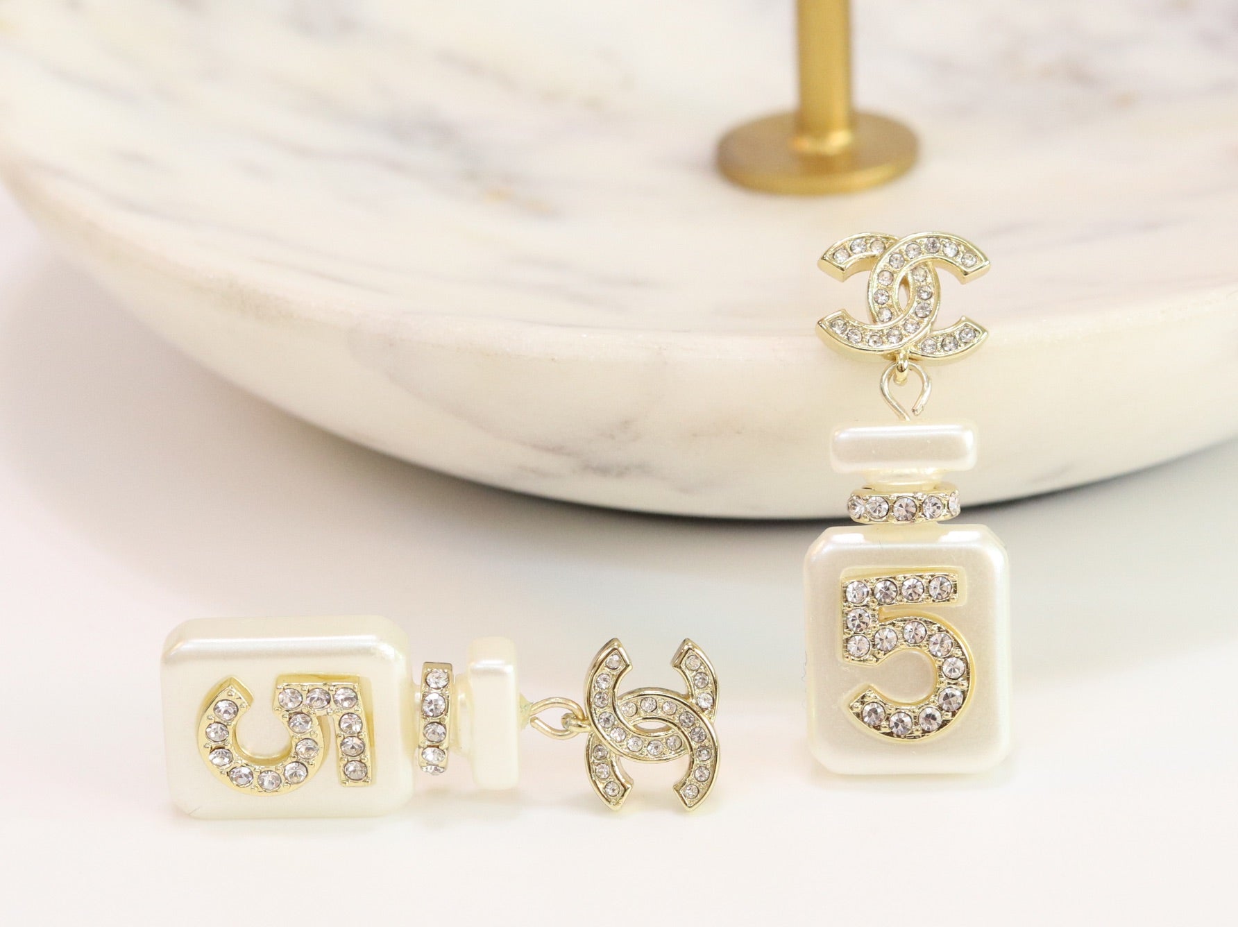 Double C gold danglers with 5 in CZ on white enamel