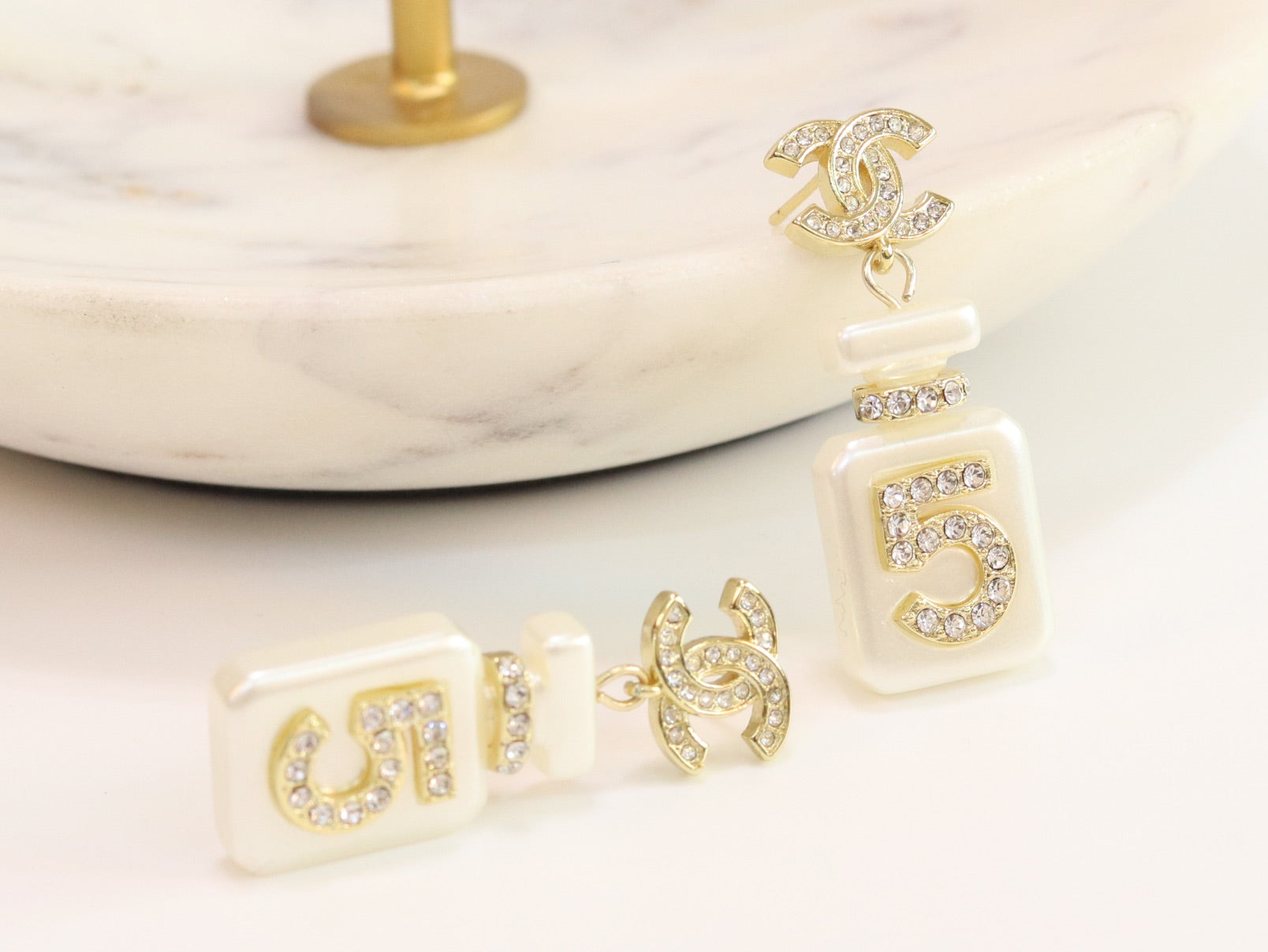 Double C gold danglers with 5 in CZ on white enamel