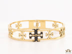 Gold plated openable bracelet with fancy cutwork T motifs