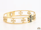 Gold plated openable bracelet with fancy cutwork T motifs