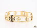 Gold plated openable bracelet with fancy cutwork T motifs