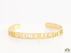 Gold plated open band bracelet with cutwork alphabets