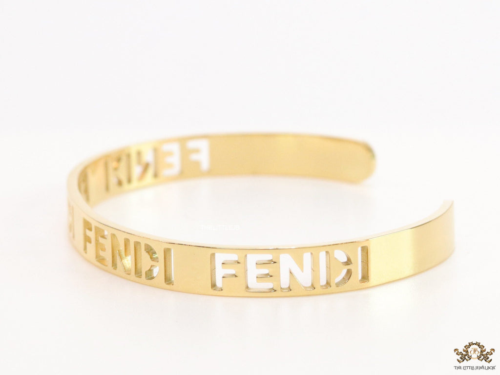 Gold plated open band bracelet with cutwork alphabets