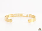 Gold plated open band bracelet with cutwork alphabets