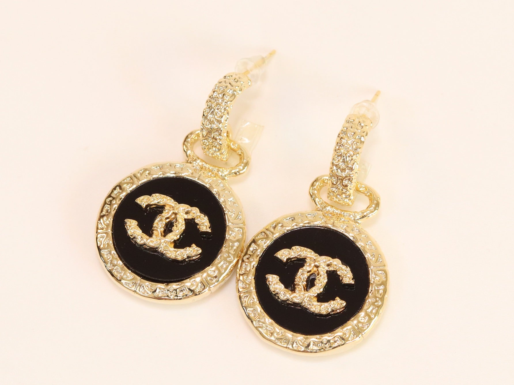 Double C on black enamel hanging gold earrings with CZ