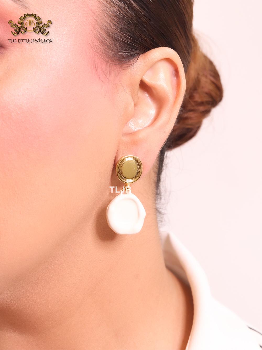 White enamel and gold earrings