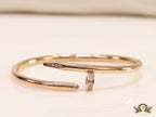 Rose gold plated nail bracelet with cz