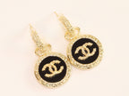 Double C on black enamel hanging gold earrings with CZ