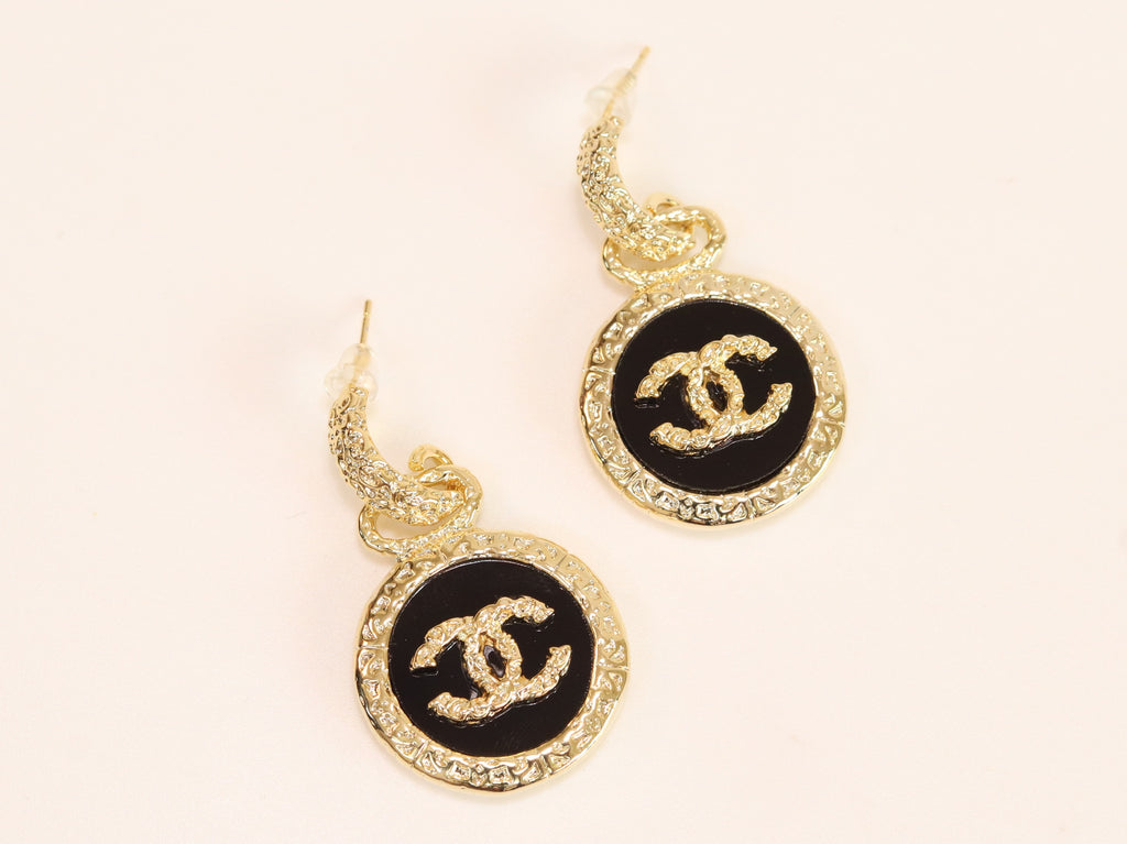 Double C on black enamel hanging gold earrings with CZ
