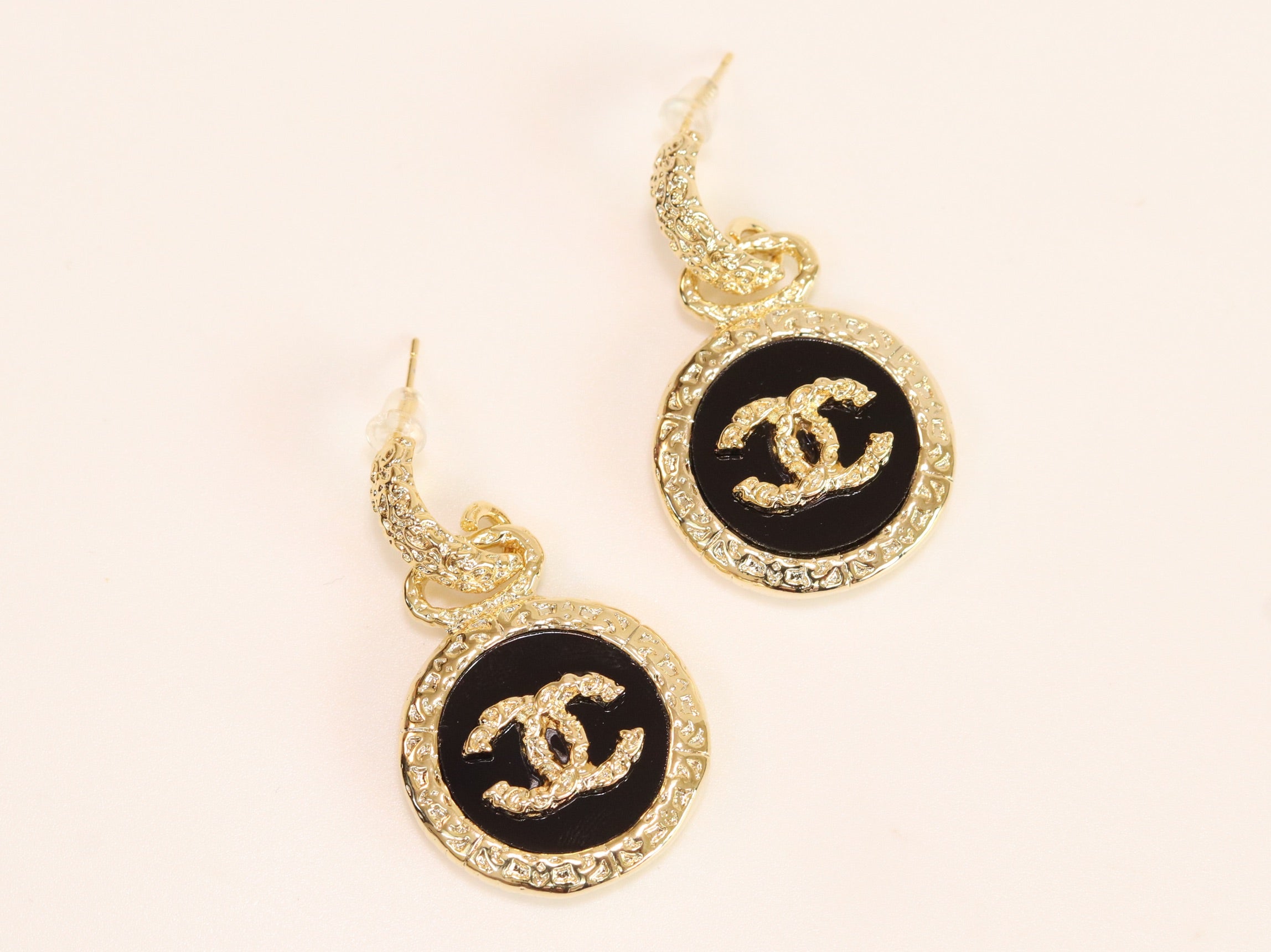 Double C on black enamel hanging gold earrings with CZ