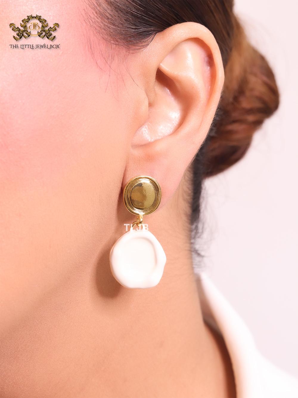 White enamel and gold earrings