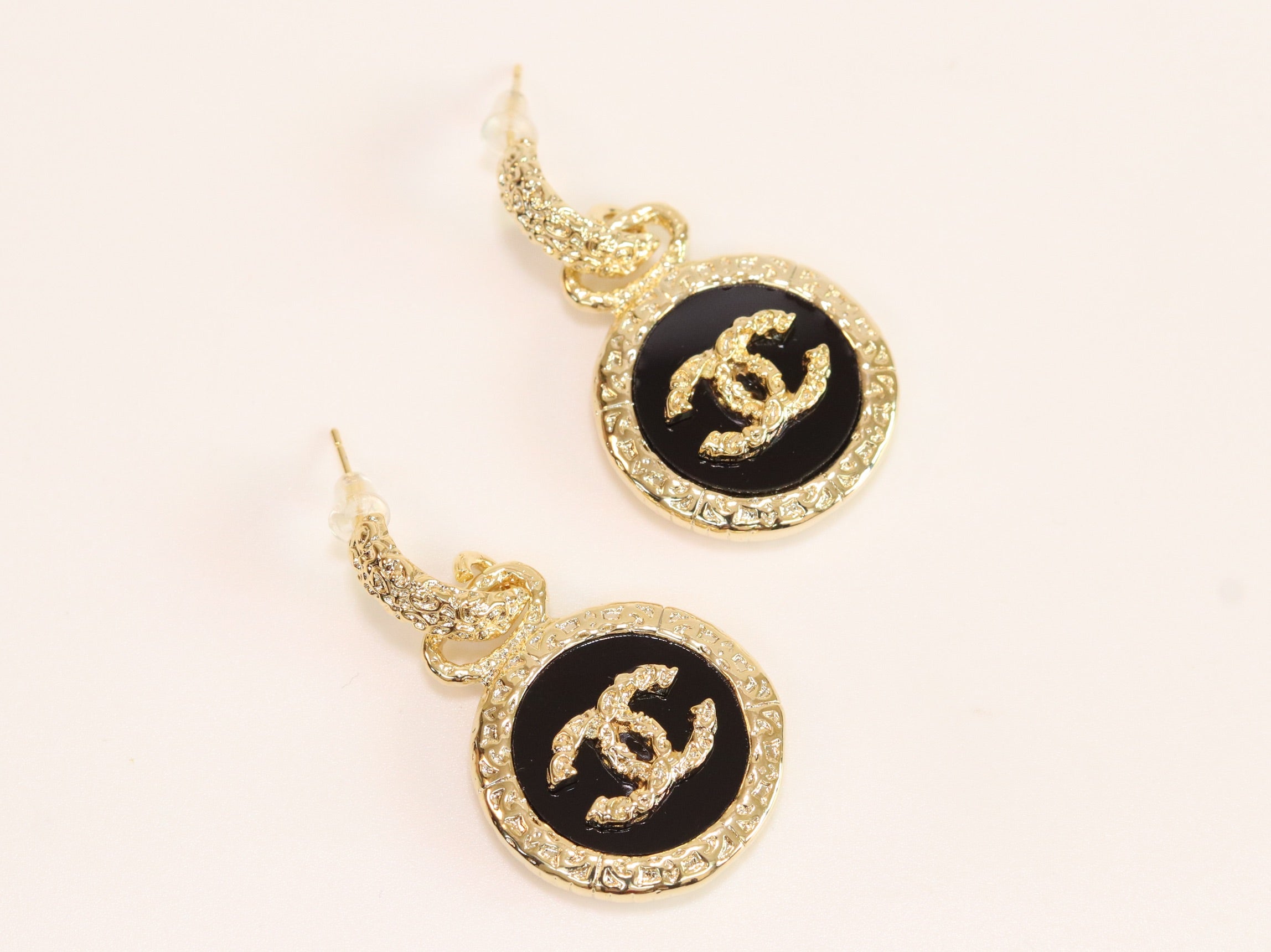 Double C on black enamel hanging gold earrings with CZ