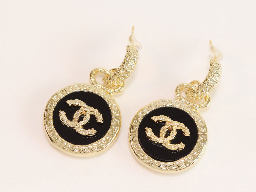 Double C on black enamel hanging gold earrings with CZ