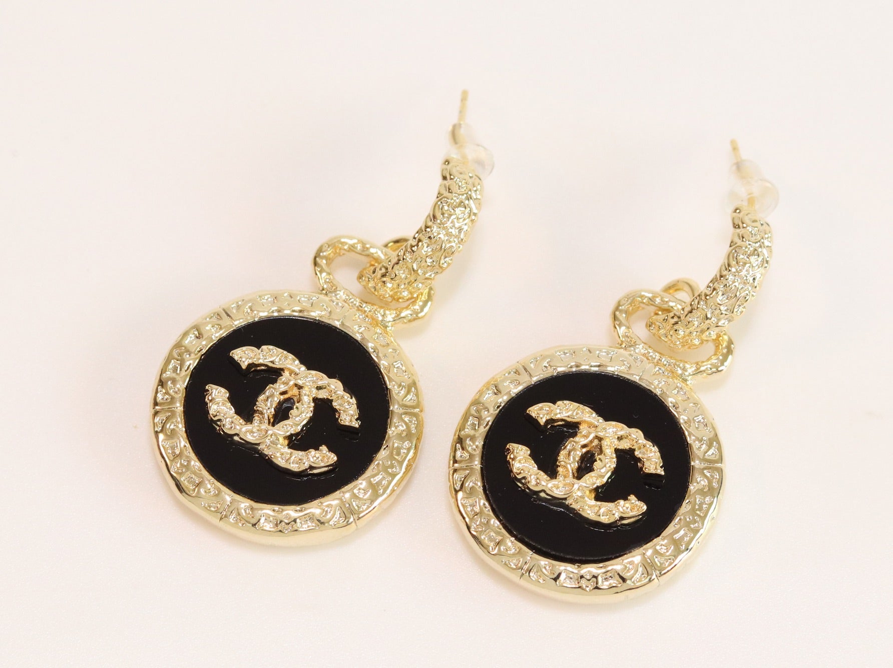 Double C on black enamel hanging gold earrings with CZ