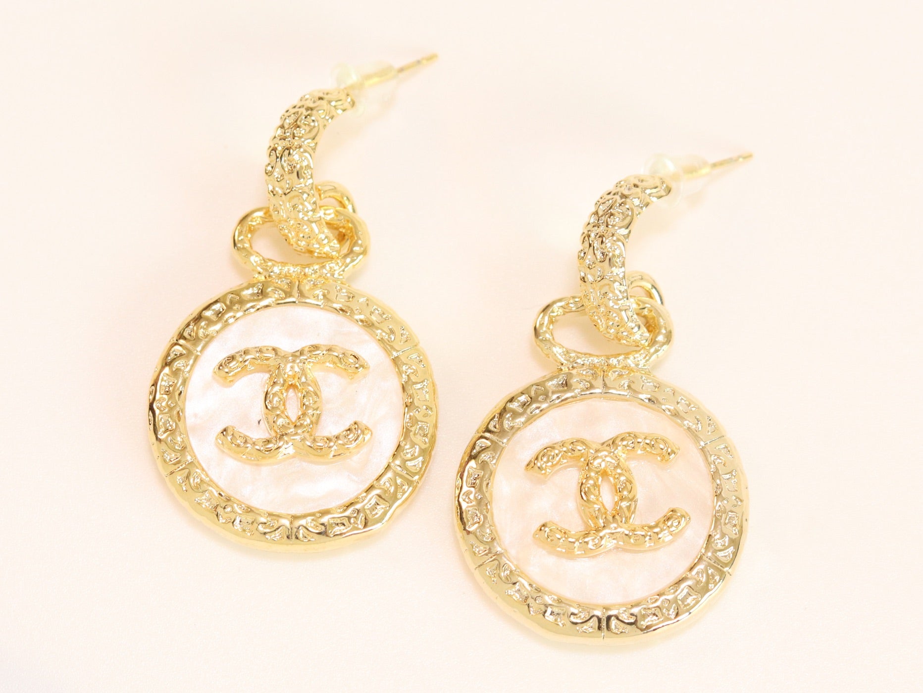 Double C on white enamel hanging gold earrings with CZ