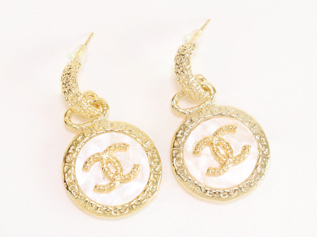 Double C on white enamel hanging gold earrings with CZ