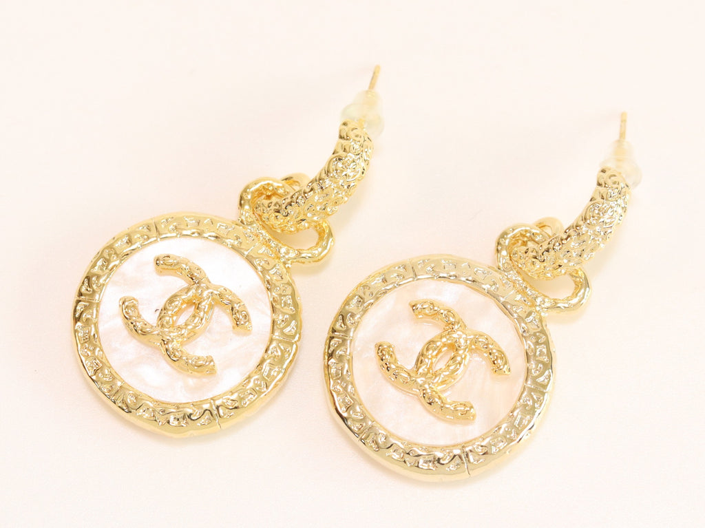 Double C on white enamel hanging gold earrings with CZ
