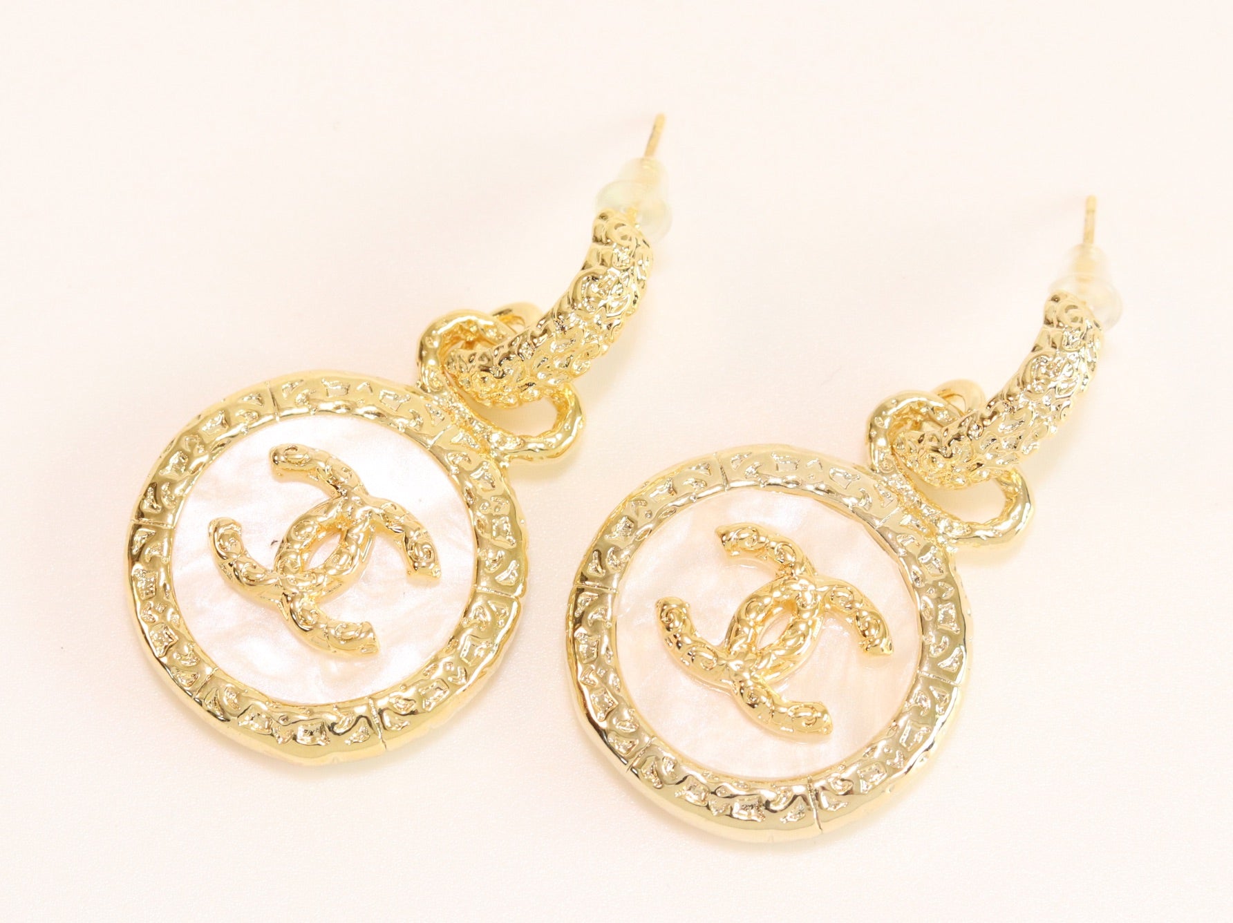 Double C on white enamel hanging gold earrings with CZ