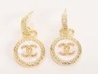 Double C on white enamel hanging gold earrings with CZ