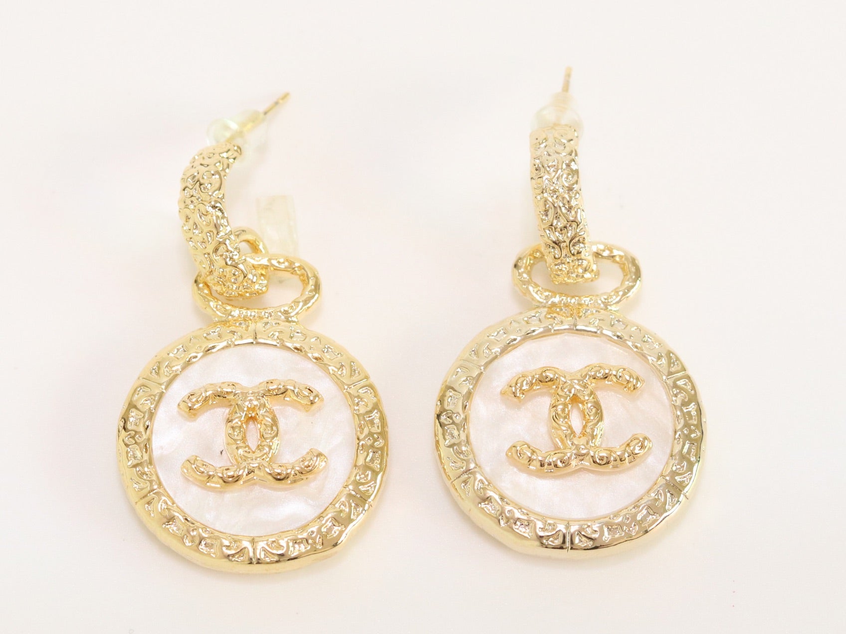 Double C on white enamel hanging gold earrings with CZ
