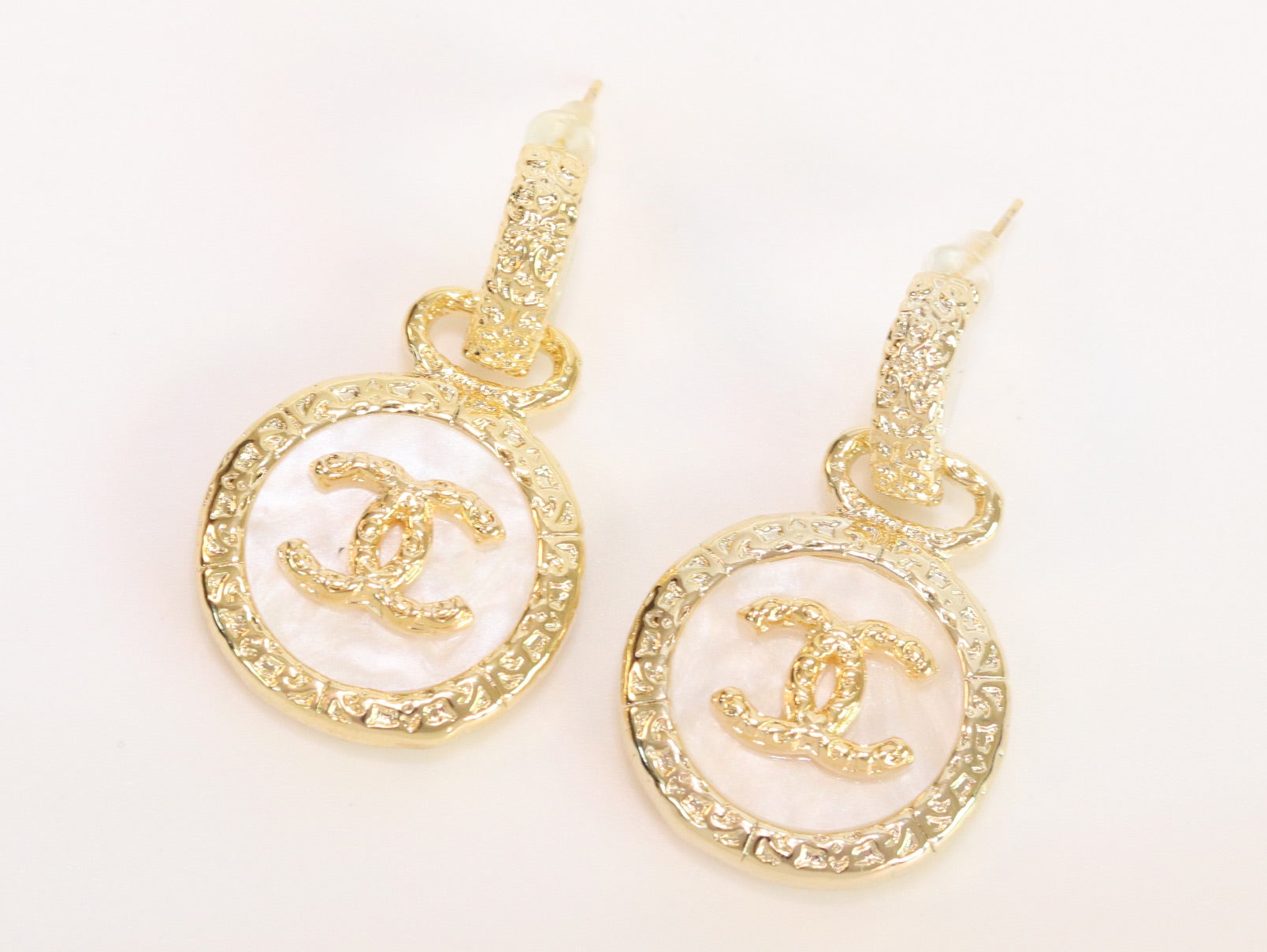 Double C on white enamel hanging gold earrings with CZ