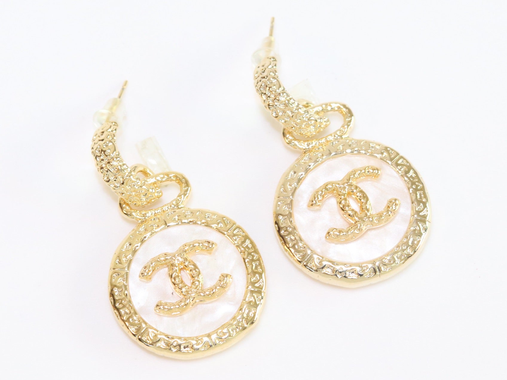 Double C on white enamel hanging gold earrings with CZ