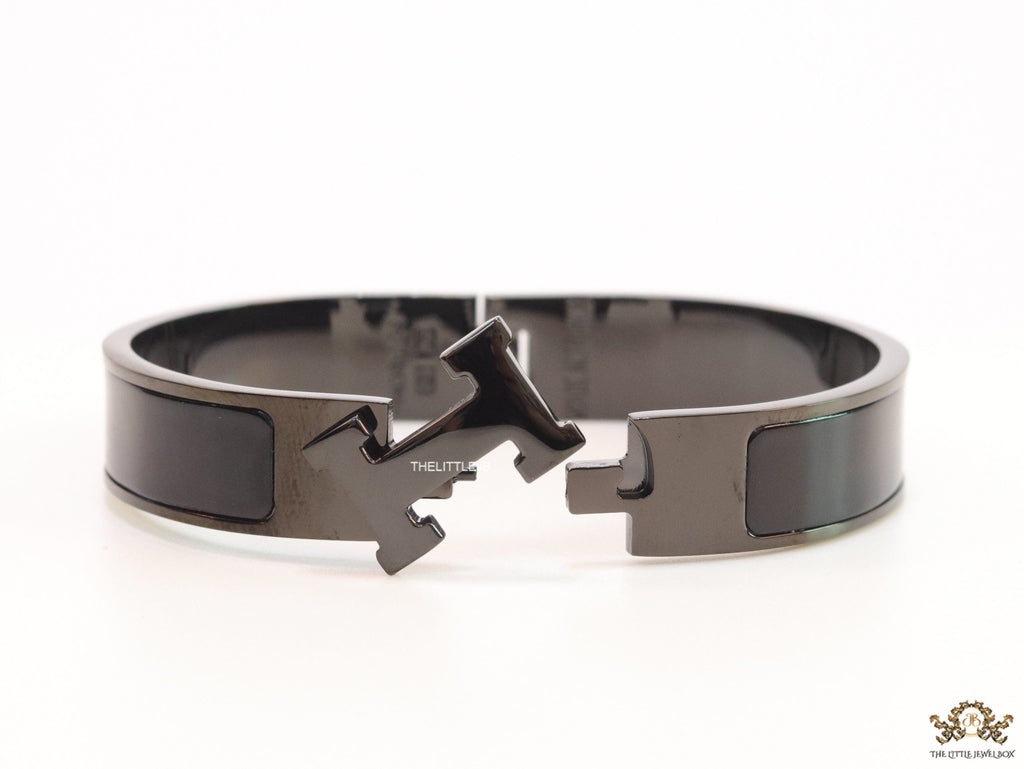 Broad black bracelet with H alphabet in centre