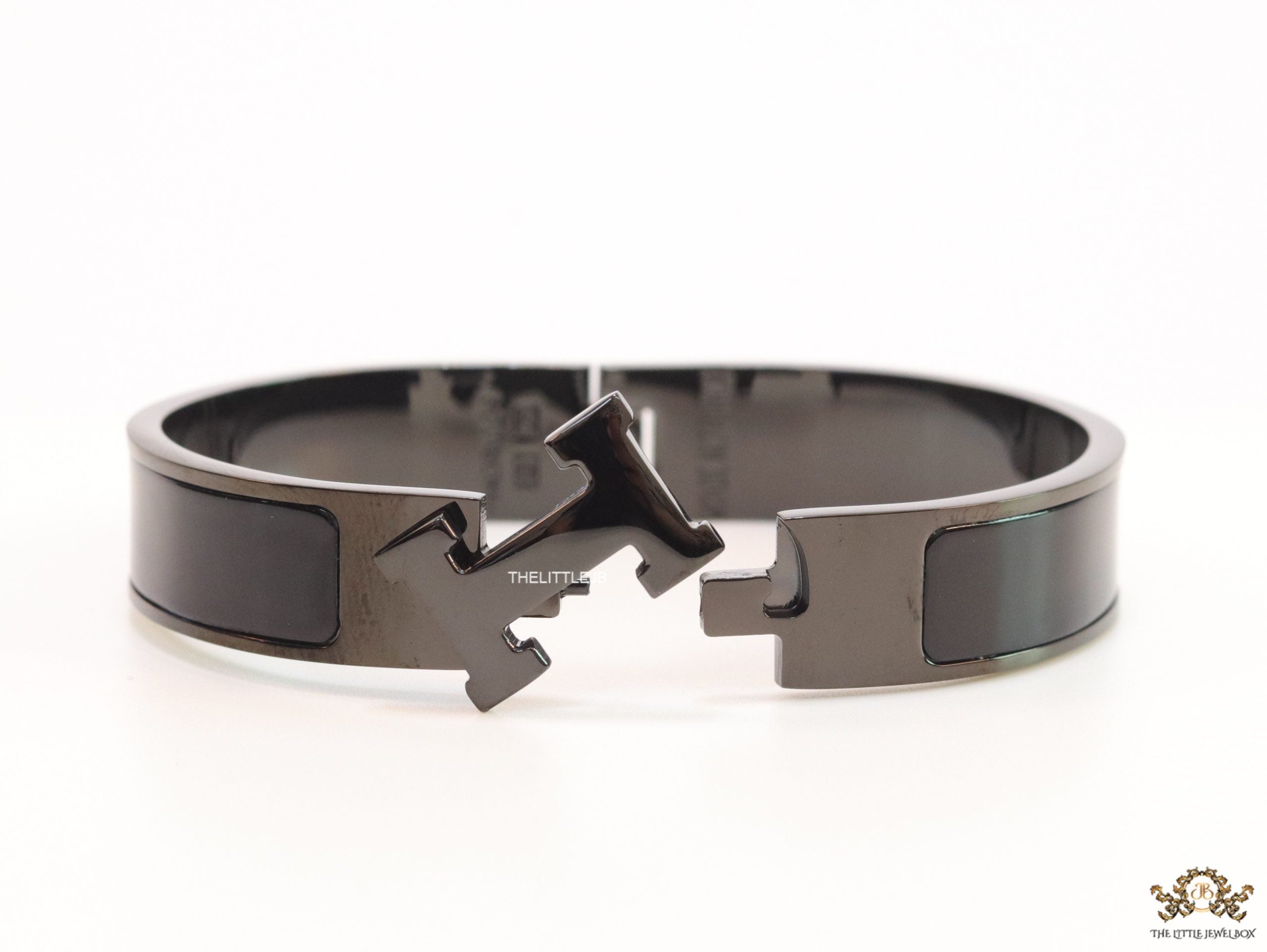 Broad black bracelet with H alphabet in centre