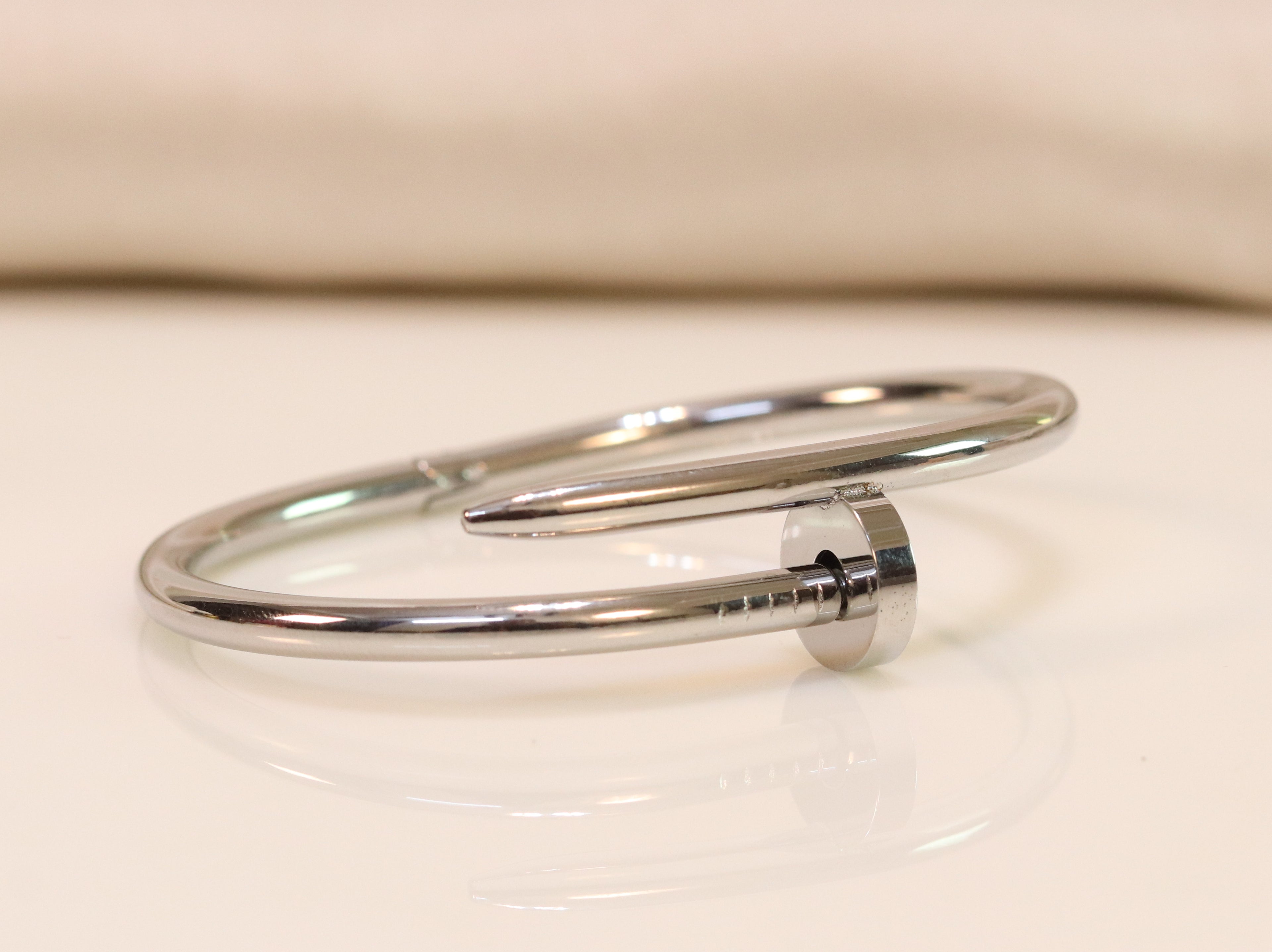 platinum plated nail bracelet with cz