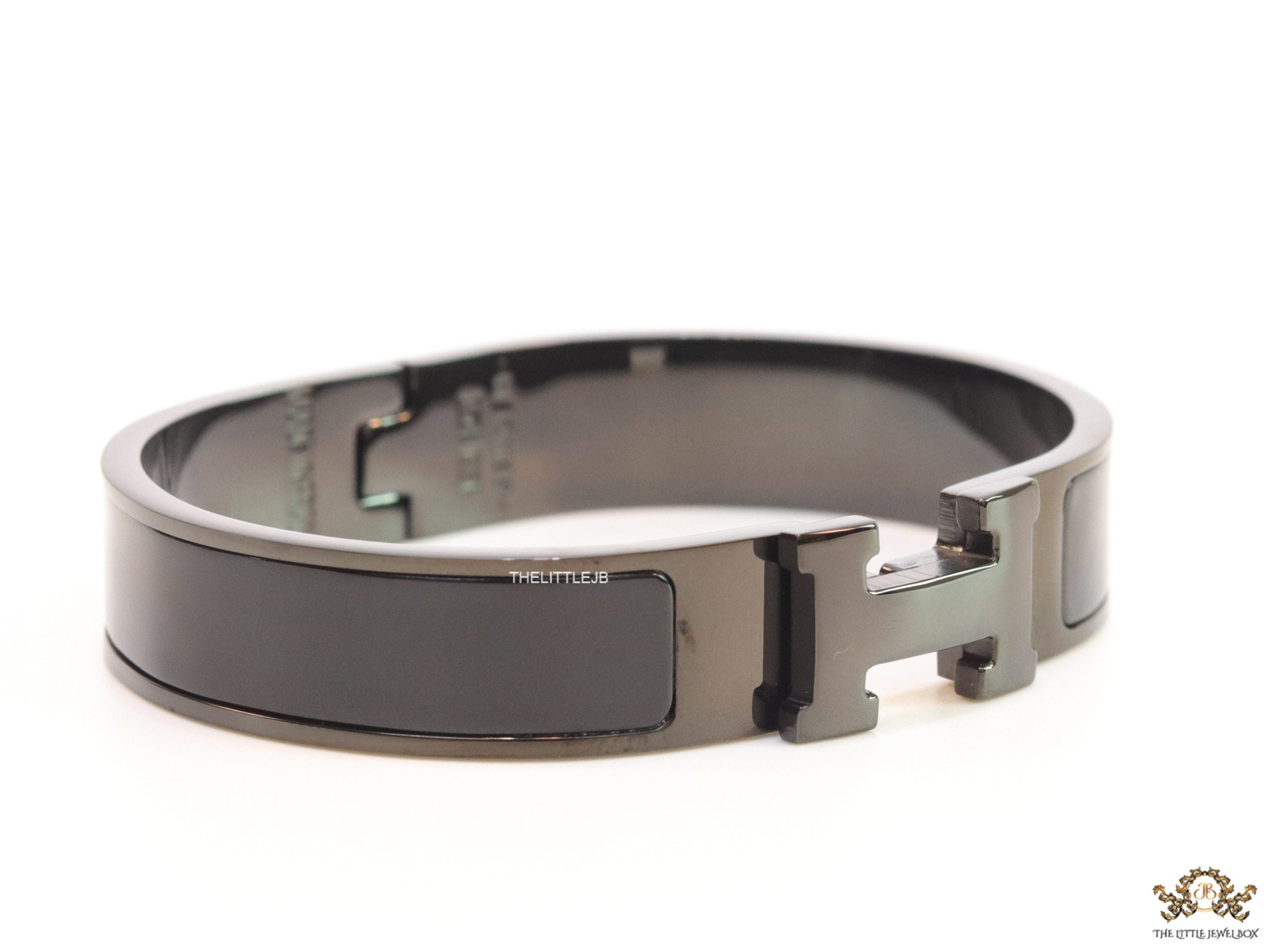 Broad black bracelet with H alphabet in centre