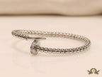 Platinum plated cz and metallic bead nail bracelet-openable