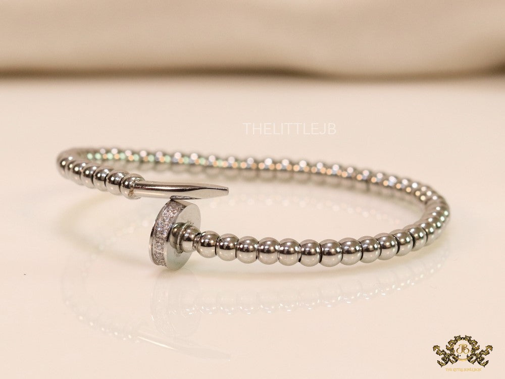 Platinum plated cz and metallic bead nail bracelet-openable