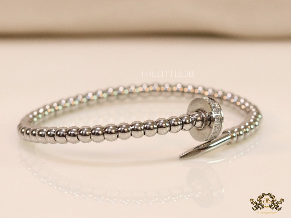 Platinum plated cz and metallic bead nail bracelet-openable