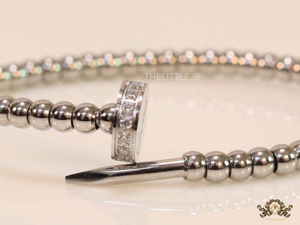 Platinum plated cz and metallic bead nail bracelet-openable