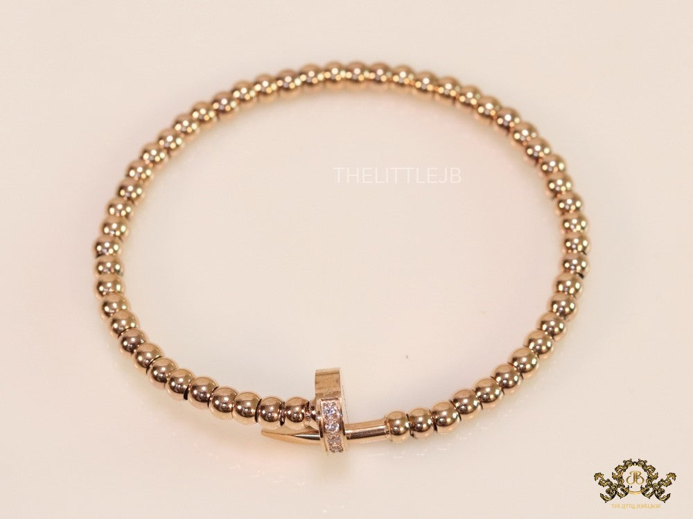Rose gold plated cz and metallic bead nail bracelet-openable