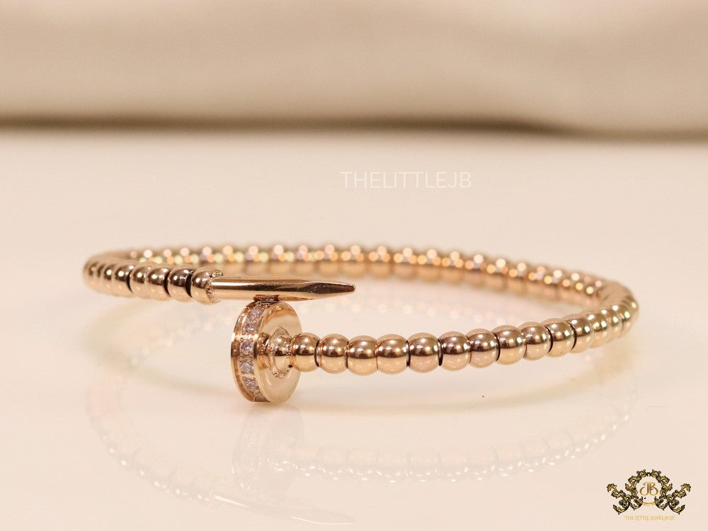 Rose gold plated cz and metallic bead nail bracelet-openable