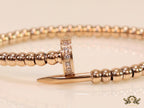 Rose gold plated cz and metallic bead nail bracelet-openable