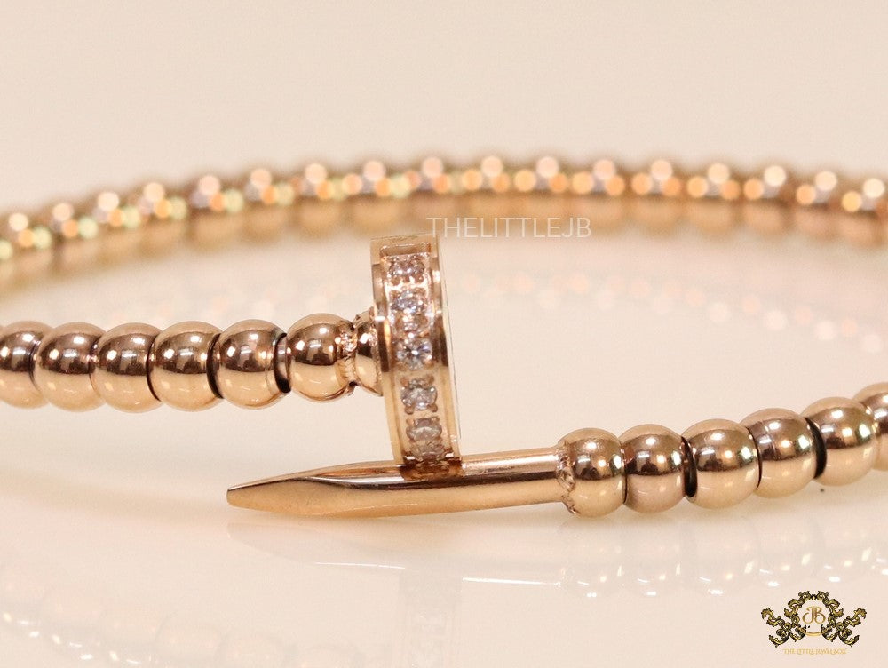 Rose gold plated cz and metallic bead nail bracelet-openable